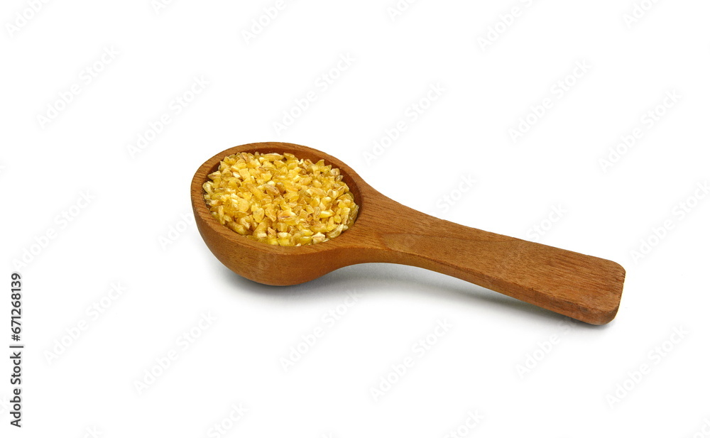 Wooden spoon with uncooked bulgur isolated on white Wooden spoon with uncooked bulgur isolated on white