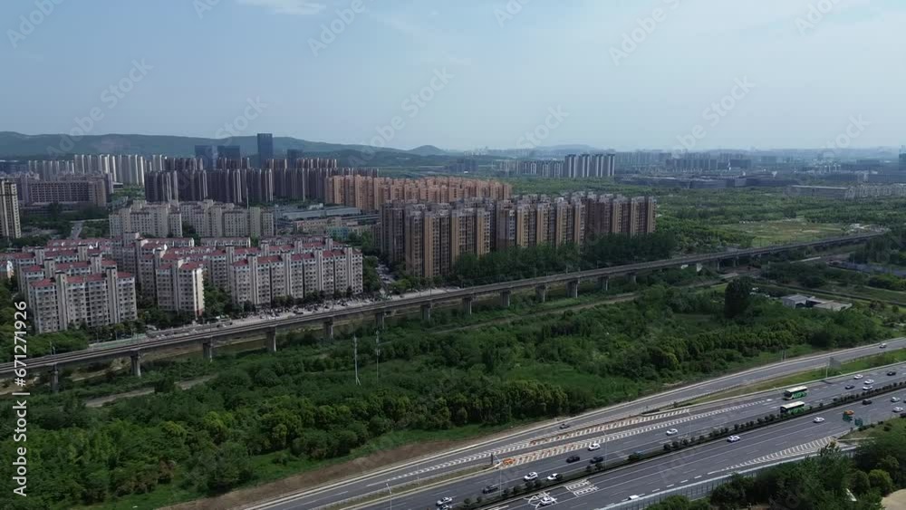 2023 - Excellent aerial view approaching skyscrapers in Nanjing, China, over the highway. 2023 - Excellent aerial view approaching skyscrapers in Nanjing, China, over the highway.