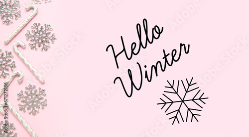 Banner with text HELLO WINTER and Christmas decor on pink background