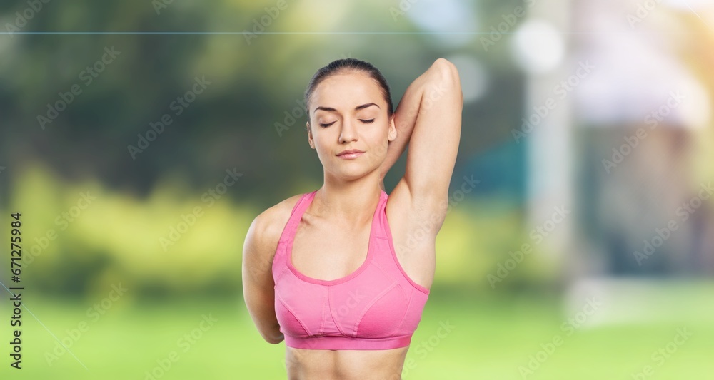 Young sporty woman stretching in park Young sporty woman stretching in park