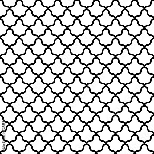 Interlocking white figures tessellation on black background. Image with floral shapes. Ethnic mosaic tiles motif. Oriental window tracery. Seamless surface pattern design with scales ornament. Vector.