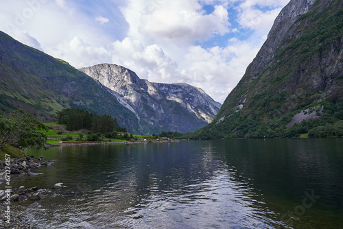 Landscape picture of Aurlandsfjorden fjord in norwegian region Aurland in calm summer evening. Beautiful place with clean nature, high mountains and deep walley, pefect to spend active summer holiday.