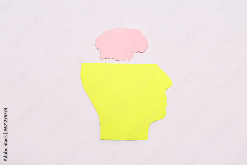 Paper human head with brain on grey background. Mental Health Day Paper human head with brain on grey background. Mental Health Day