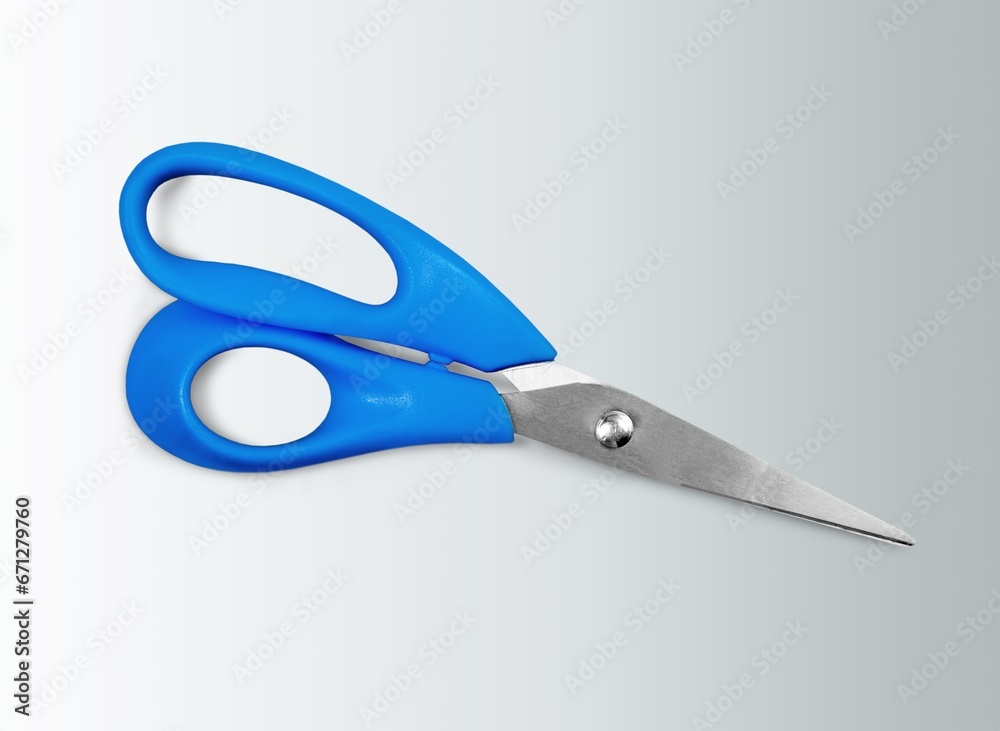 A pair of blue school scissors on a desk A pair of blue school scissors on a desk