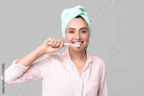 Young woman with toothbrush...