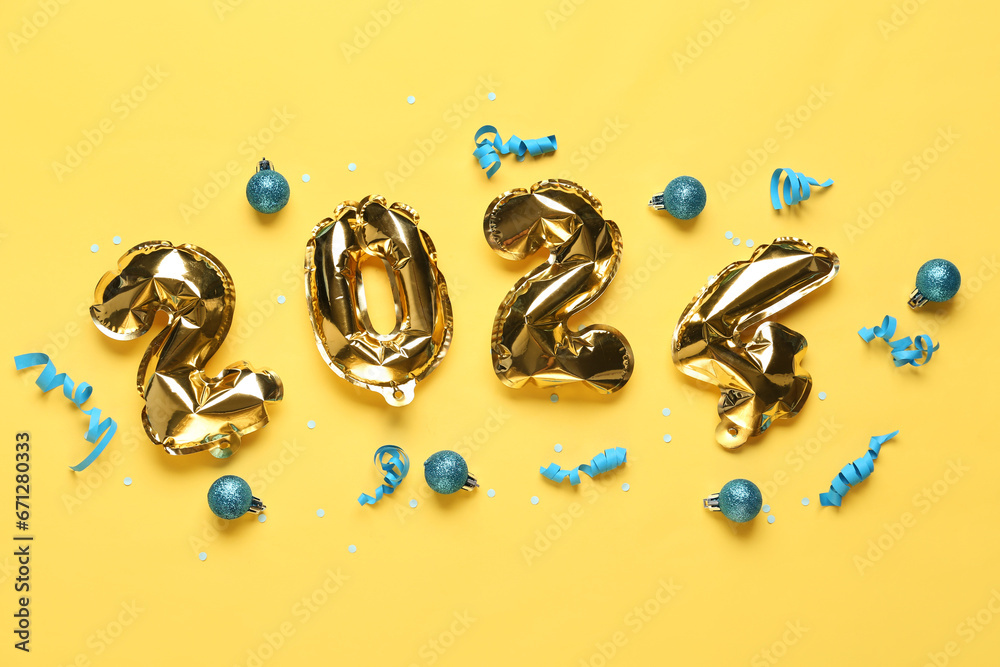 Figure 2024 made of balloons with Christmas balls and ribbons on yellow background Figure 2024 made of balloons with Christmas balls and ribbons on yellow background