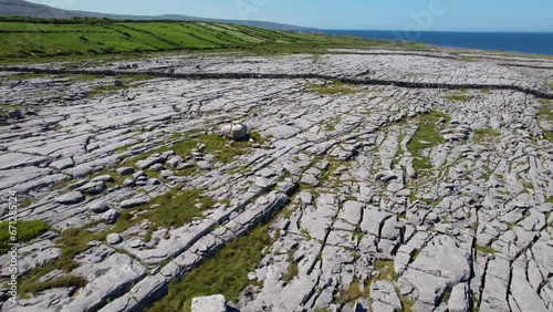 IRELAND- 8.27.2023 -Excellent aerial footage moving over The Burren in Ireland, towards green hills. photo