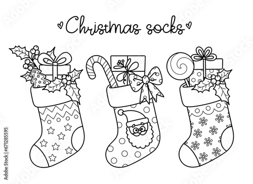 Outline cartoon Christmas winter socks for holiday design. Traditional Xmas stockings with gift boxes, candy, gingerbread, mistletoe. Vector contour illustrations perfect for New Year coloring page.