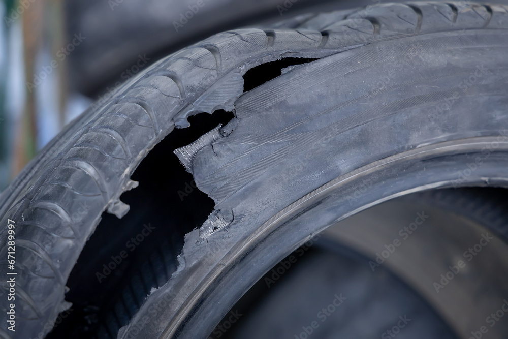 Torn tire. The result of a tire explosion closeup. Used tires for recycling using pyrolysis