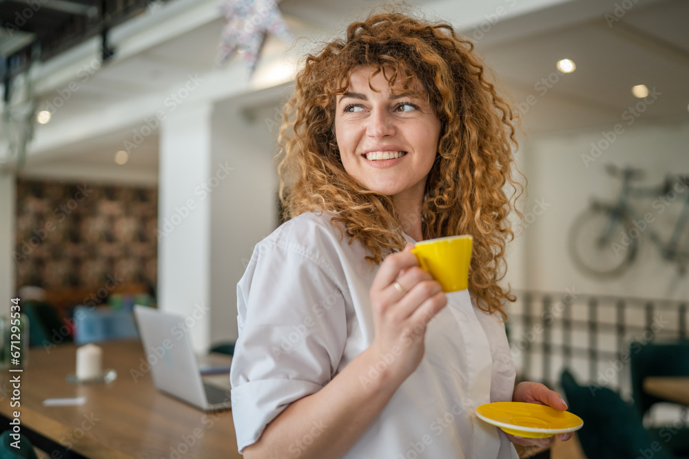 Woman adult caucasian female happy smile hold cup of coffee at cafe Woman adult caucasian female happy smile hold cup of coffee at cafe