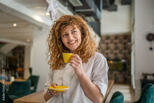 Woman adult caucasian female happy smile hold cup of coffee at cafe