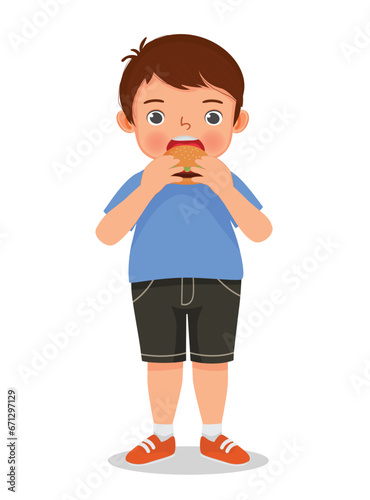 fat obese little boy feel hungry eating hamburger junk food