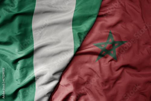 big waving national colorful flag of nigeria and national flag of morocco .