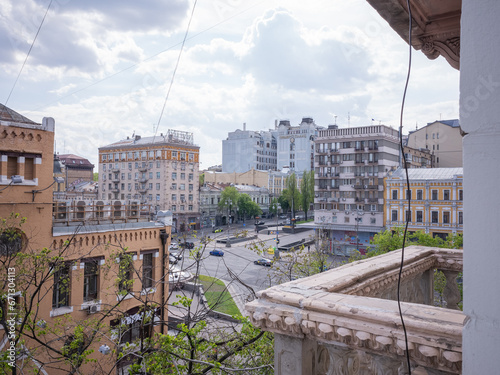 historical and modern buildings seen from the terrace of apartment in capital kyiv photo