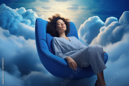 A young African American woman enjoys restful sleep while sitting in an armchair surrounded by clouds. After a good night's sleep, we are more productive, think clearly, and make better decisions photo