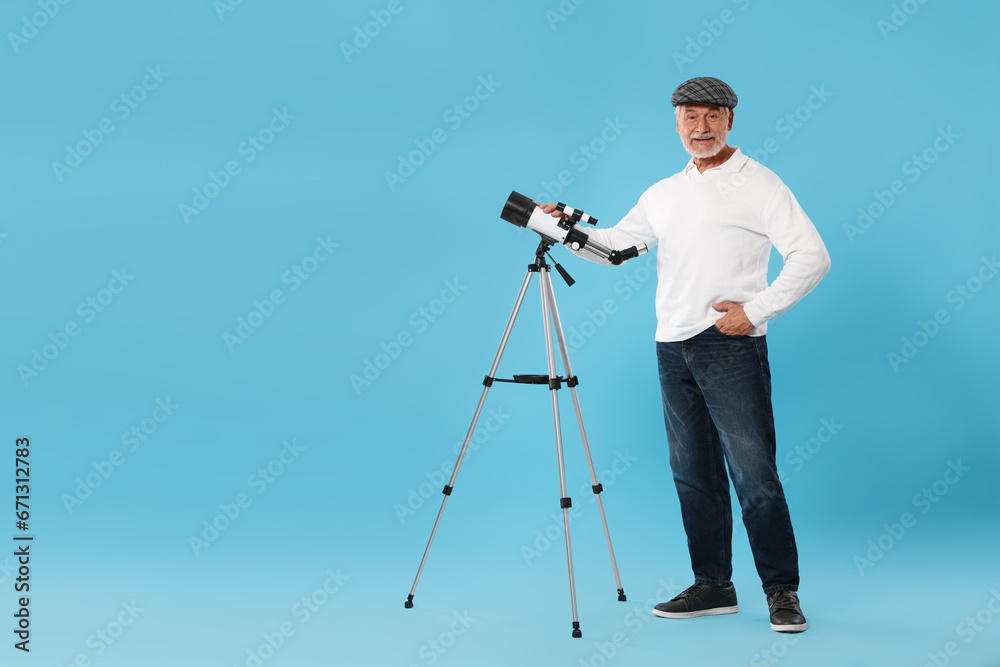 Senior astronomer with telescope on light blue background Space for text