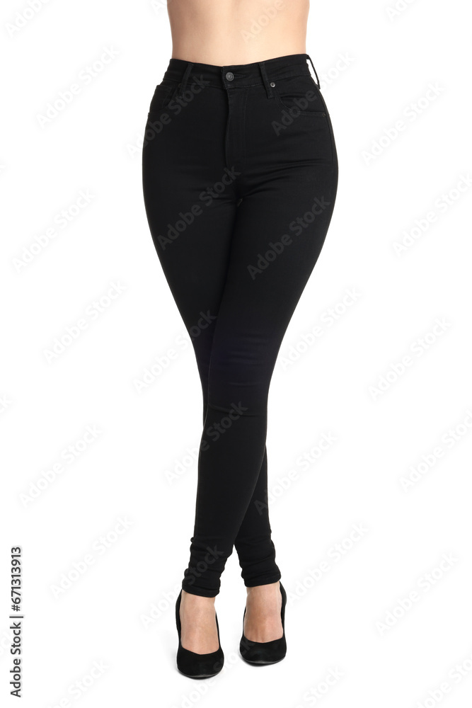 Woman wearing stylish black jeans and high heels shoes on white background, closeup Woman wearing stylish black jeans and high heels shoes on white background, closeup