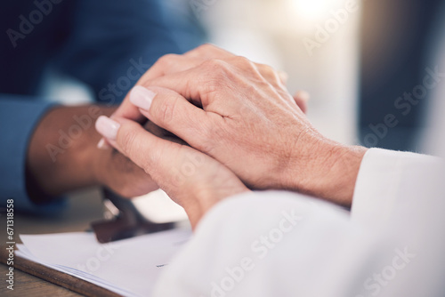 Cancer, empathy and doctor holding hands of patient for care, kindness and hope. Comfort, medical professional and person consulting for wellness, healthcare and help, therapy and support in hospital