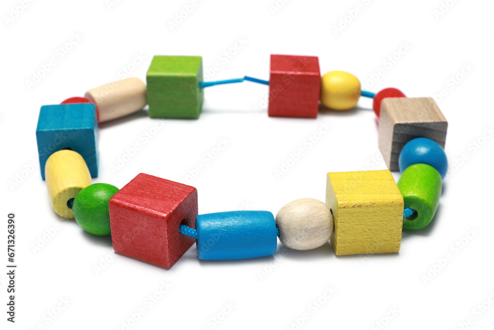 Wooden pieces and string for threading activity isolated on white. Educational toy for motor skills development Wooden pieces and string for threading activity isolated on white. Educational toy for motor skills development