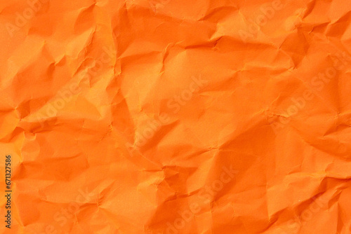 Orange crumpled paper texture used for paper background texture in decorative art work