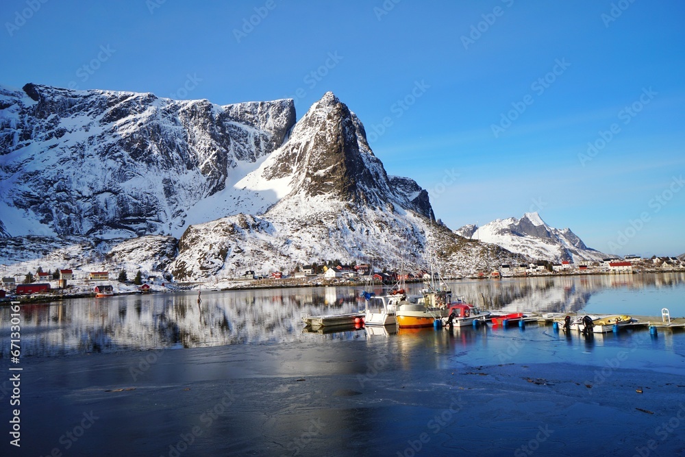 Fisherman village with snow mountain background at Norway, Europe.