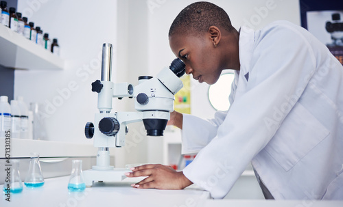 Senior, scientist and black woman, microscope and analysis of data, medical research and science study in lab. Future, knowledge and investigation, female doctor and check DNA sample with chemistry photo