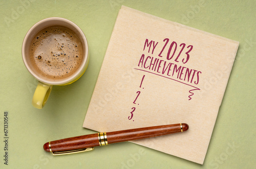 my 2023 achievements - blank list on a napkin, flat lay with a cup of coffee, personal review of the recent year