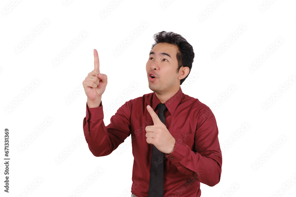 Asian male businessman pointing his finger at empty space, smiling face Asian male businessman pointing his finger at empty space, smiling face