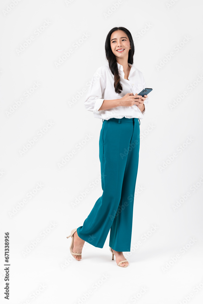 Beautiful Asian woman holding smartphone and smiling on white background. Beautiful Asian woman holding smartphone and smiling on white background.