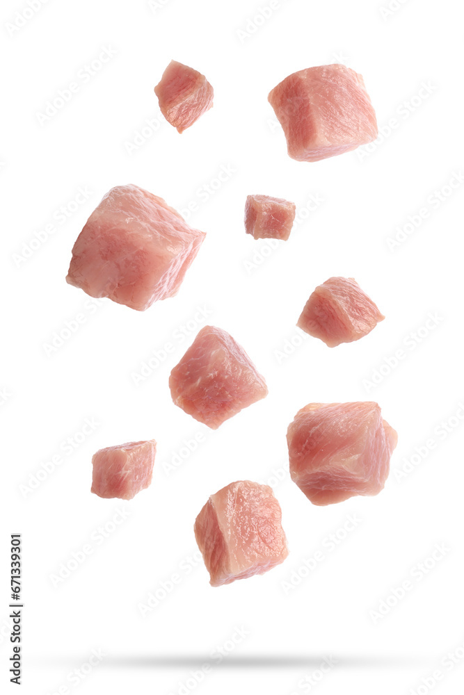 Pieces of raw pork for goulash falling on white background Pieces of raw pork for goulash falling on white background