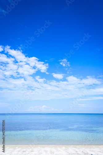 Tropical white sand beach in a blue sky sunny day. Portrait. Aglicay, Romblon, Philippines
