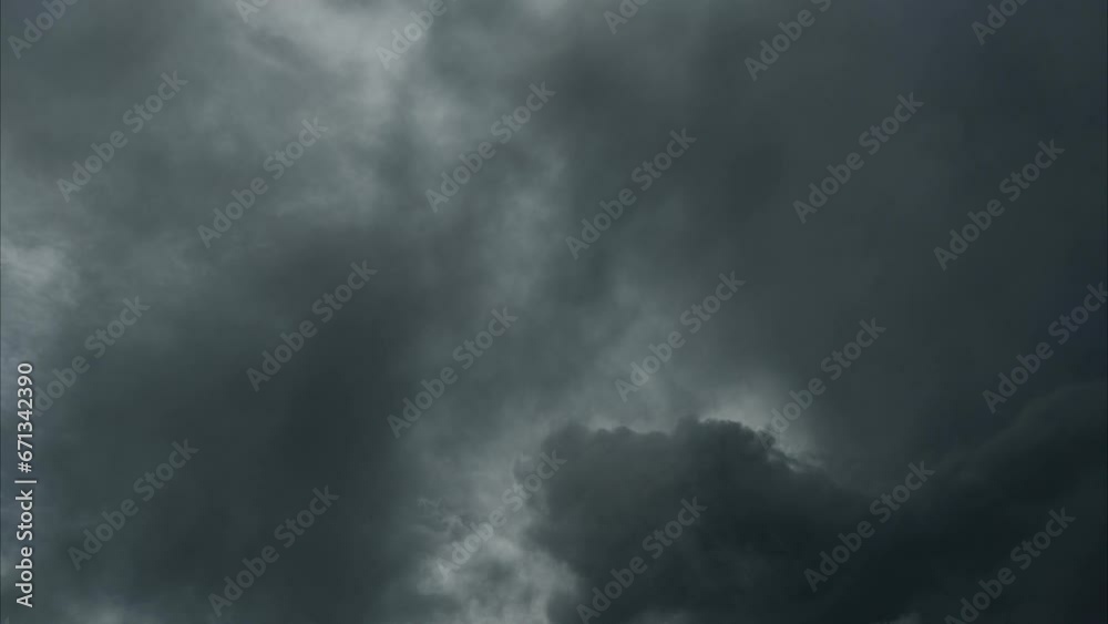 Time lapse aerial view of sky and black clouds. Black and white tones of the sky on a rainy day. Dark grey storm clouds. Dramatic sky before the storm. Time lapse aerial view of sky and black clouds. Black and white tones of the sky on a rainy day. Dark grey storm clouds. Dramatic sky before the storm.
