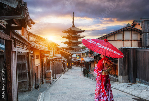 Japanese woman wearing a traditional Japanese kimono at Yasaka Pagoda and Sannen Zaka Street in Kyoto, Japan. photo
