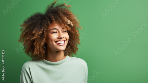Happy young african american woman on a solid background
