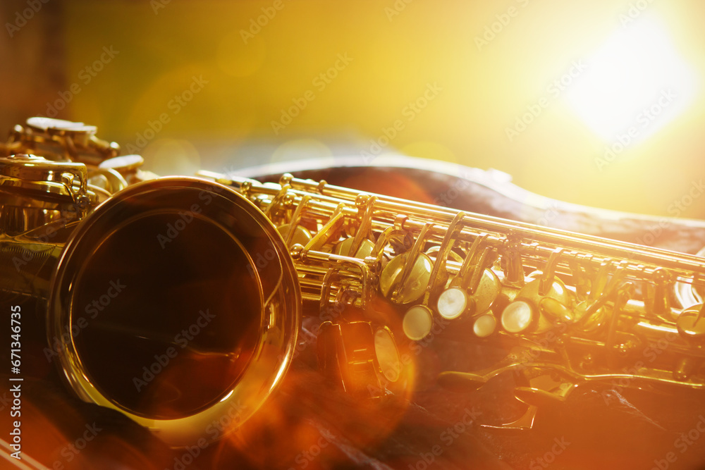 close up of a saxophone in open case on table against widow light effected, copy space for music decoration or poster background - obrazy, fototapety, plakaty 
