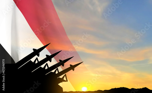 Silhouette of missiles with Yemen flag against the sunset. EPS10 vector