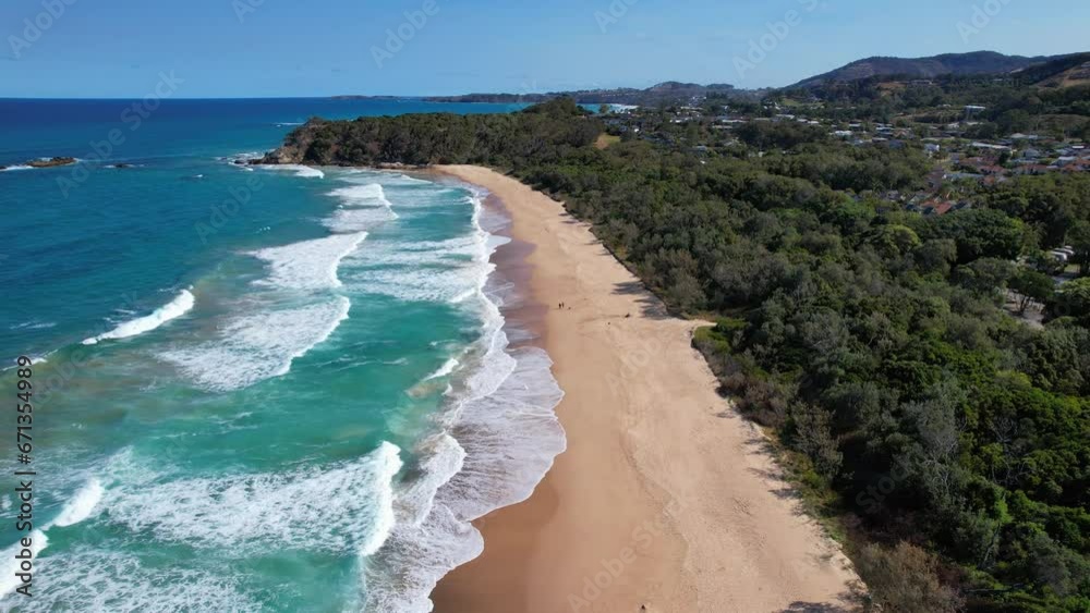 Foamy Waves Splashing On The Sandy Shore Of Sapphire Beach In New South Wales, Australia - aerial shot Foamy Waves Splashing On The Sandy Shore Of Sapphire Beach In New South Wales, Australia - aerial shot