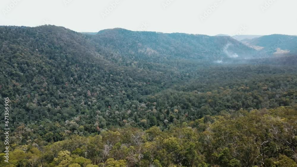 Drone aerial in an Australian mountain valley with clouds Drone aerial in an Australian mountain valley with clouds