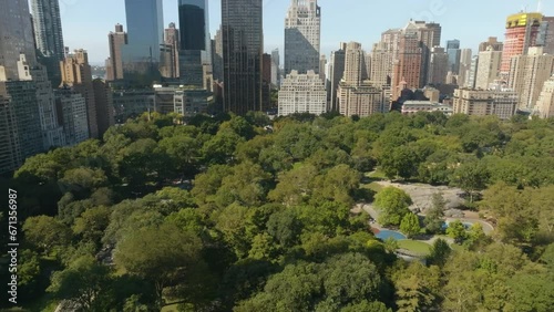 Drone shot tilting over the Central park, sunny day in Manhattan, New York