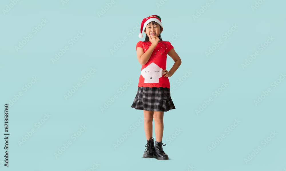 Cheerful young Asian girl wearing a Christmas sweater with reindeer horns, Happy smiling standing with Looking surprise posing full body portrait, isolated on blue background Cheerful young Asian girl wearing a Christmas sweater with reindeer horns, Happy smiling standing with Looking surprise posing full body portrait, isolated on blue background