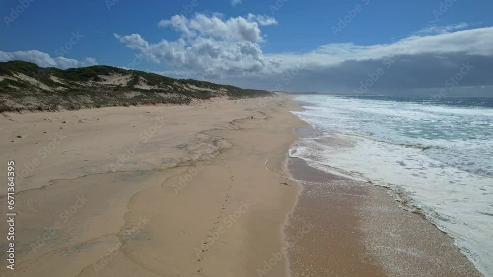 Foamy Ocean Waves And Sandy Shore At Mungo Beach In New South Wales, Australia - drone shot Foamy Ocean Waves And Sandy Shore At Mungo Beach In New South Wales, Australia - drone shot