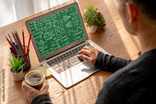 Mathematic equations and modish formula on computer screen showing concept of science and education photo