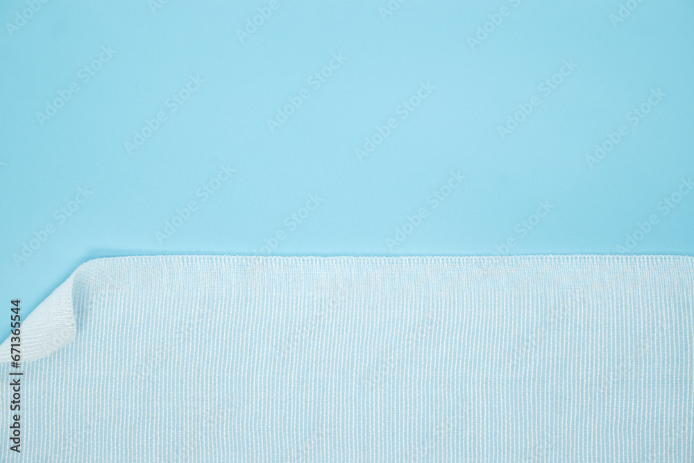 texture of comfortable elastic bandage on blue background - obrazy, fototapety, plakaty 