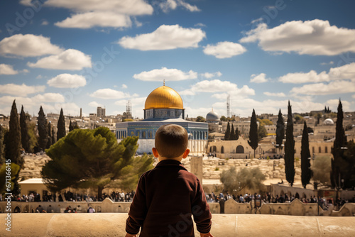 Palestine kid or child looking at al aqsa mosque with free palestine aqsa mosque protect concept. photo