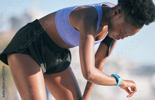 Outdoor, fitness and black woman with progress, smart watch and target with exercise, wellness and body health. Female person, runner and athlete with tech, challenge and performance while breathing