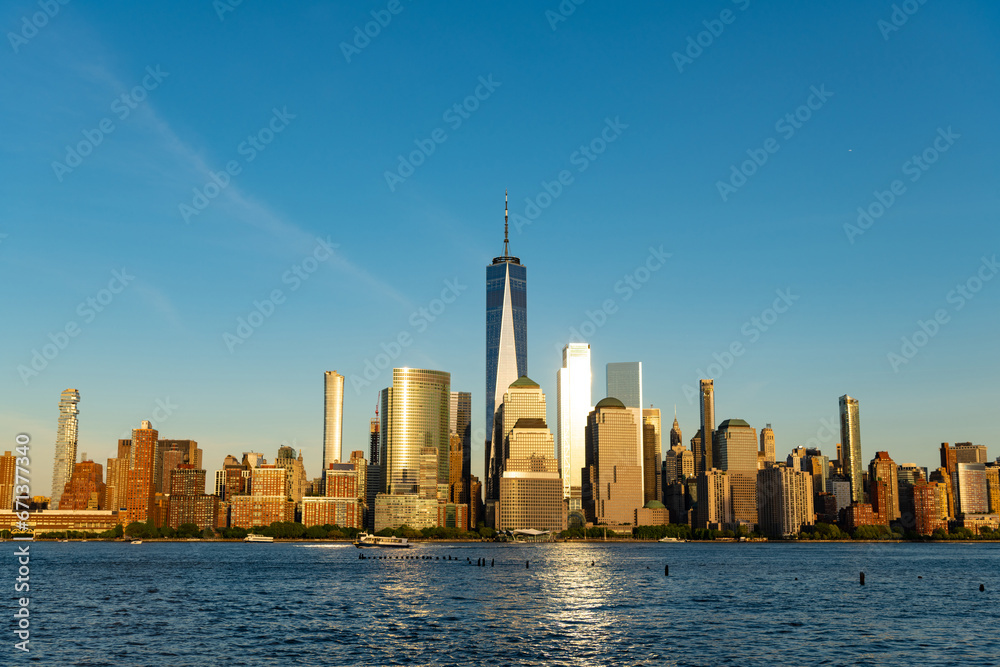 Naklejka premium ny urban city architecture. midtown manhattan and hudson river. metropolitan city cityscape. new york downtown. manhattan skyline in sunset. new york city. skyscraper building of nyc. scenic view