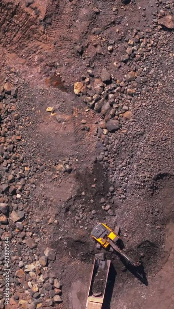Aerial view of diggers and dump trucks strip mining for gold and silver, Filmed in the Philippines. Aerial view of diggers and dump trucks strip mining for gold and silver, Filmed in the Philippines.