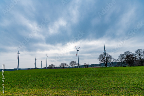 Alternative renewable energy generation. green energy. Wind mill for renewable electric energy production. Windmill in a rural area. offshore wind park. Wind Turbines Farm. Clean renewable energy