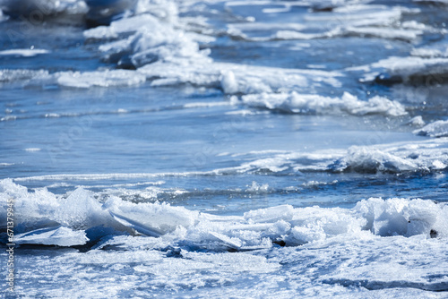 Frozen sea surface with fragments of ice, natural background photo