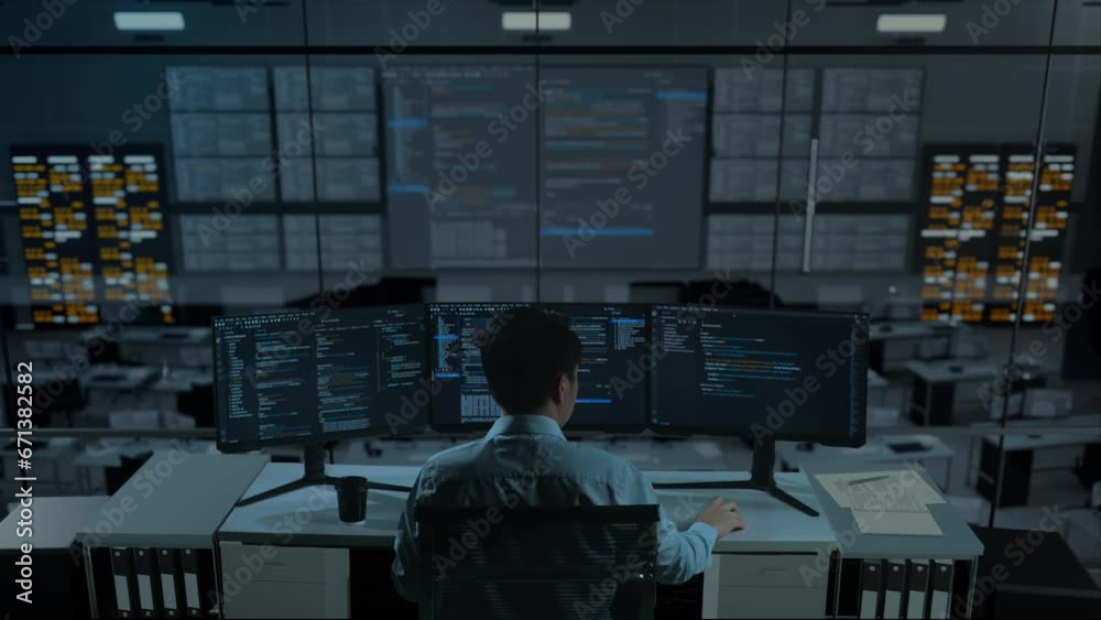 Back View Of Asian Man Developer Using Computer To Write Code With Multiple Screens In The Office
Back View Of Asian Man Developer Using Computer To Write Code With Multiple Screens In The Office